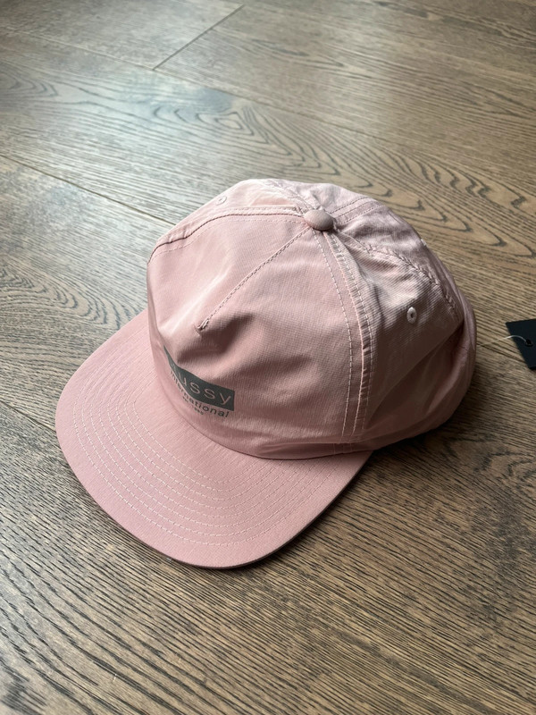 Pink stussy baseball cap sales