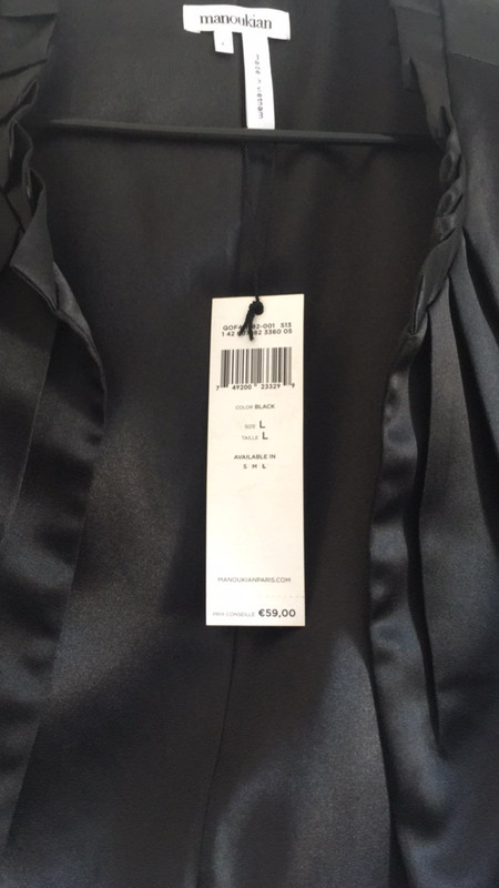 Gillet noir  à manche courte acheter en magazin manoukian tout neuf avec encor l'étiquette dessus  2