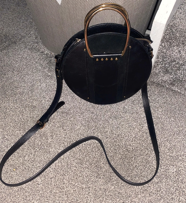 Black leather round circular cross body handbag gold handles river ...