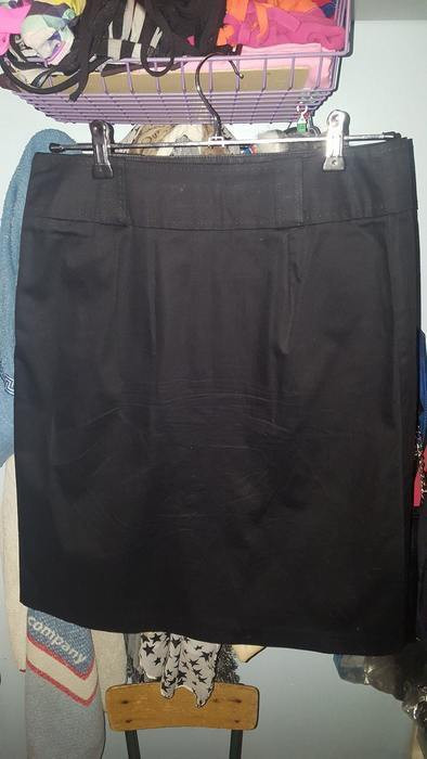 Jupe noire, 60cm de long, coton, 2 poches devant 2