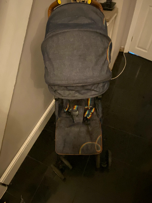A Little Bird lightweight unisex denim stroller. Size from birth