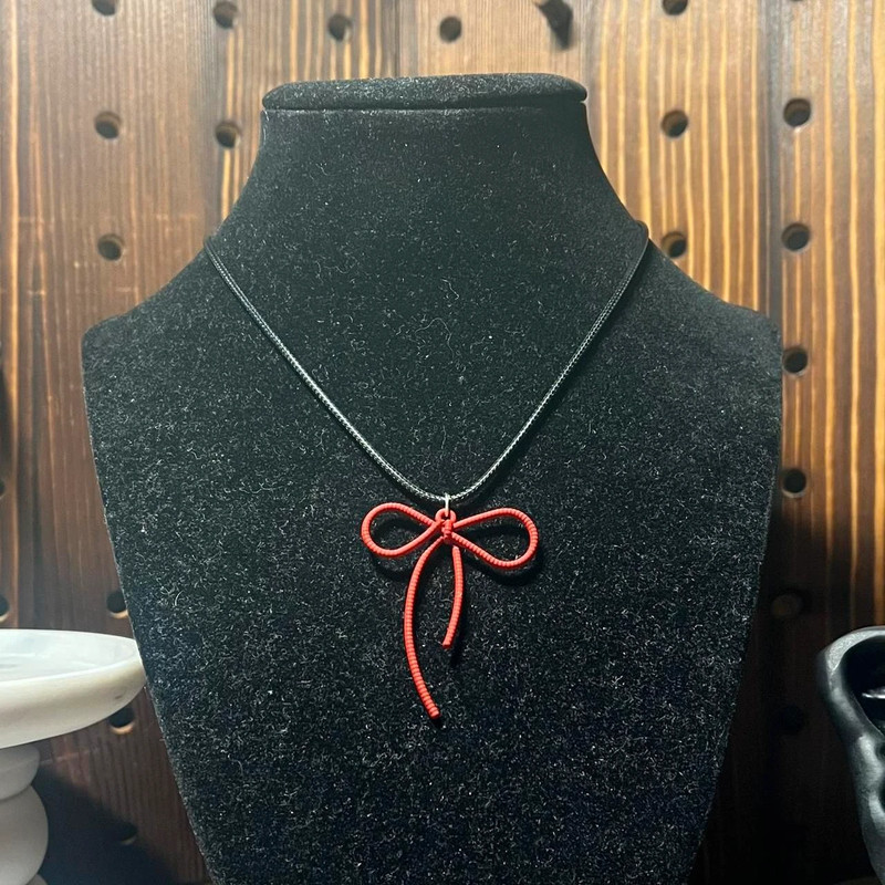 handmade coquette indie black cord necklace with red bow pendant 1