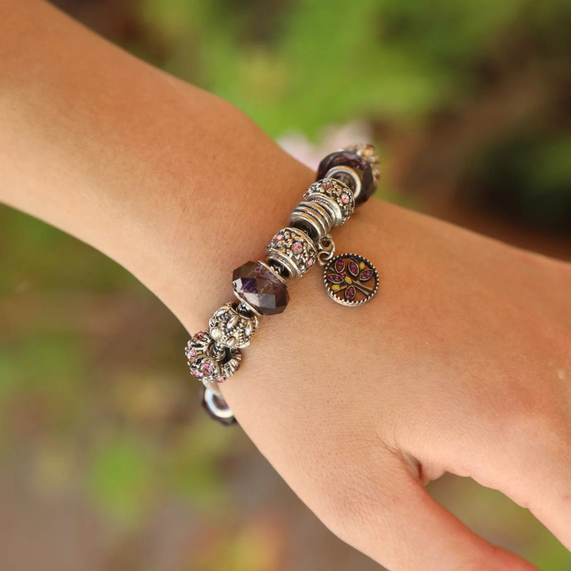 silver charm bracelet with purple beads 1