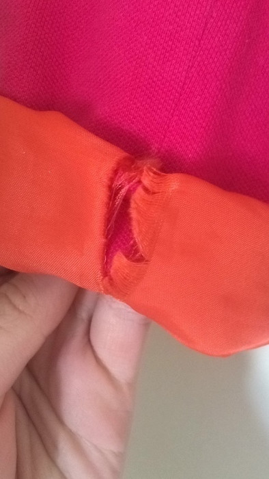 Veste rose chic avec une touche de orange dans les manches 3