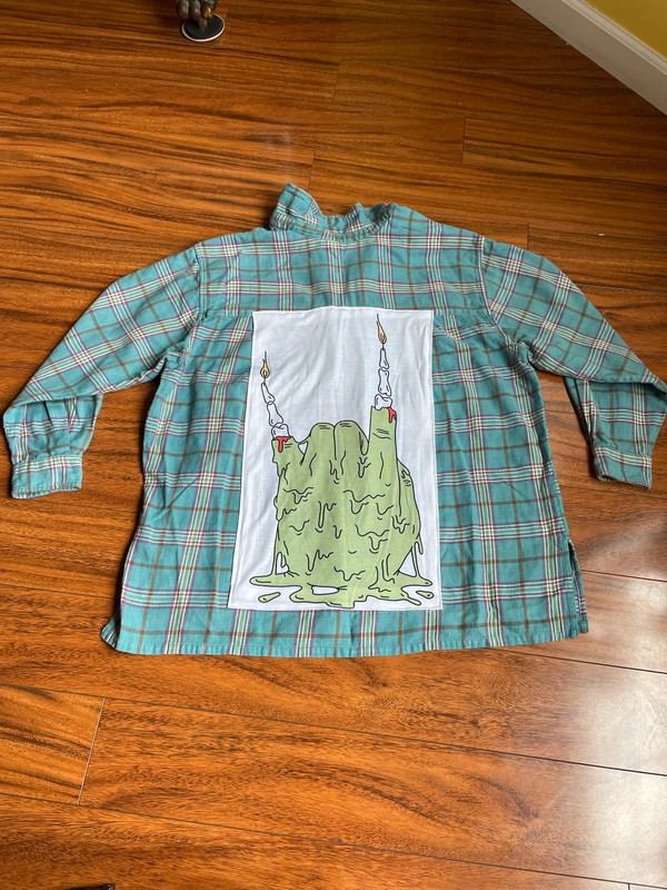 handmade reworked zombie hand candle flannel 2