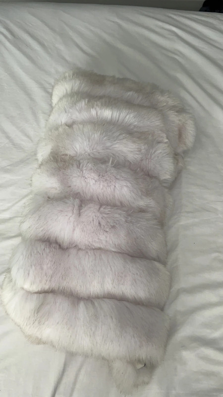 White faux fur coat. Size Large but fits 8 10