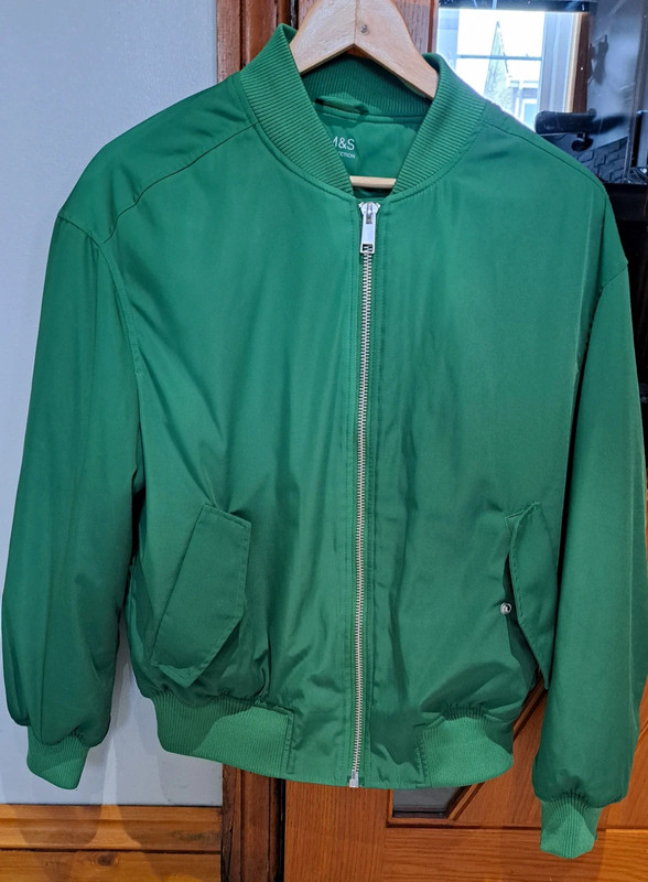 Green bomber jacket with ruffle design on back and sleeves padded so ...