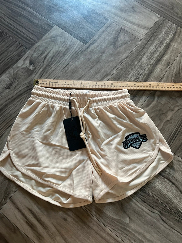 NEW Alphalete Woman’s Varsity Short - Tan ,size XS 4