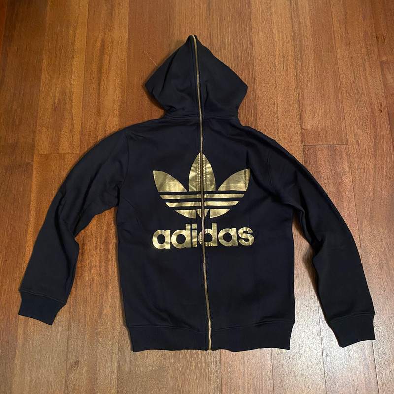 Adidas hoodie with logo on back hot sale