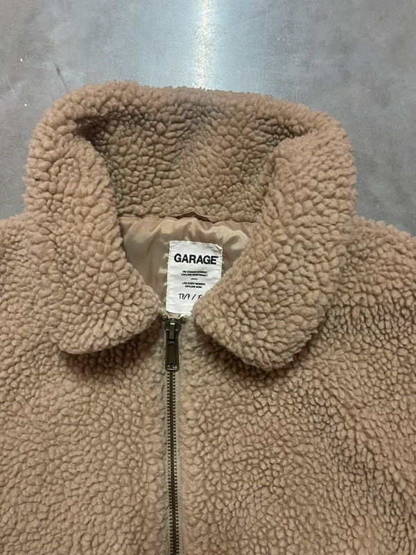 Teddy bear jacket’s brand is garage. 2