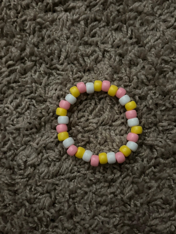 Pink, yellow and white beaded bracelet 1