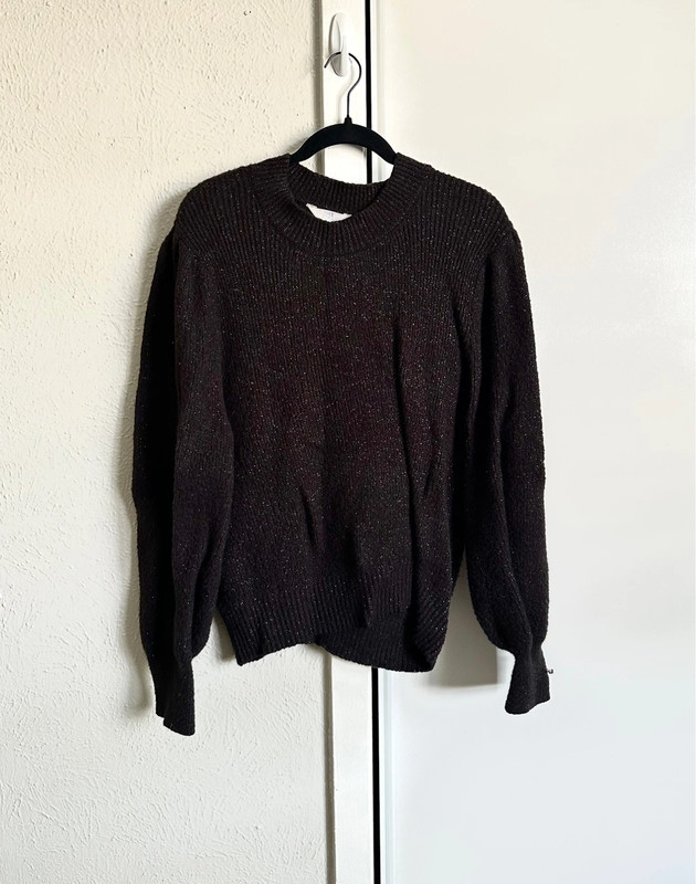 Black sweater with shiny threads. 1