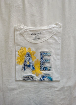 T-shirt Aéropostale Blanc Avec Motif En Relief, brand: Aéropostale, condition: Good, size: XL, €7.00, €8.05 includes Buyer Protection