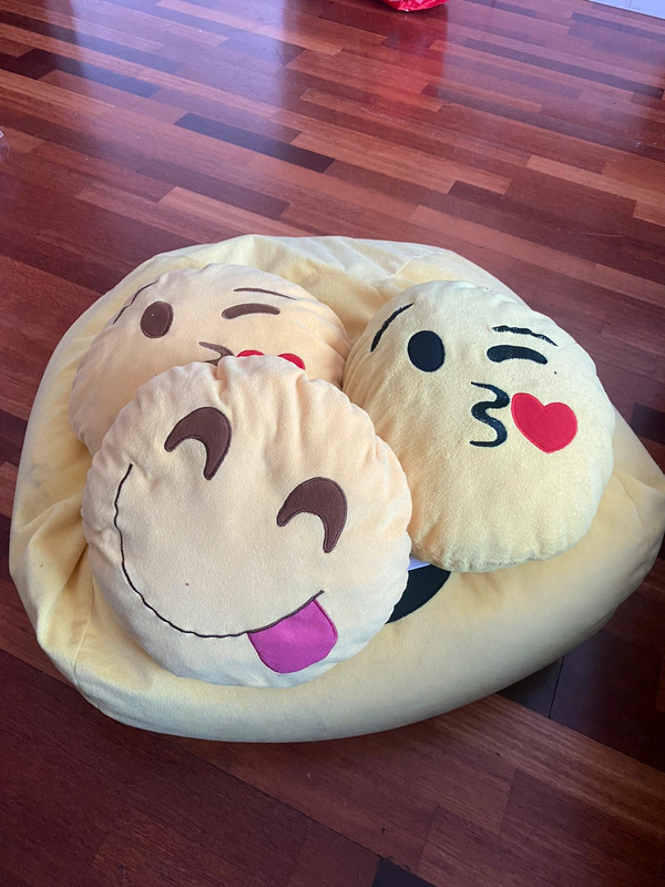 huge emoji bean bag with three mini emoji plushies 1