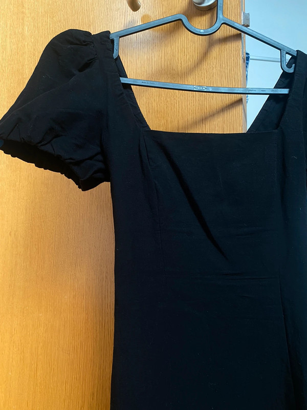 Vestido nini negro con detalle en la espalda 5