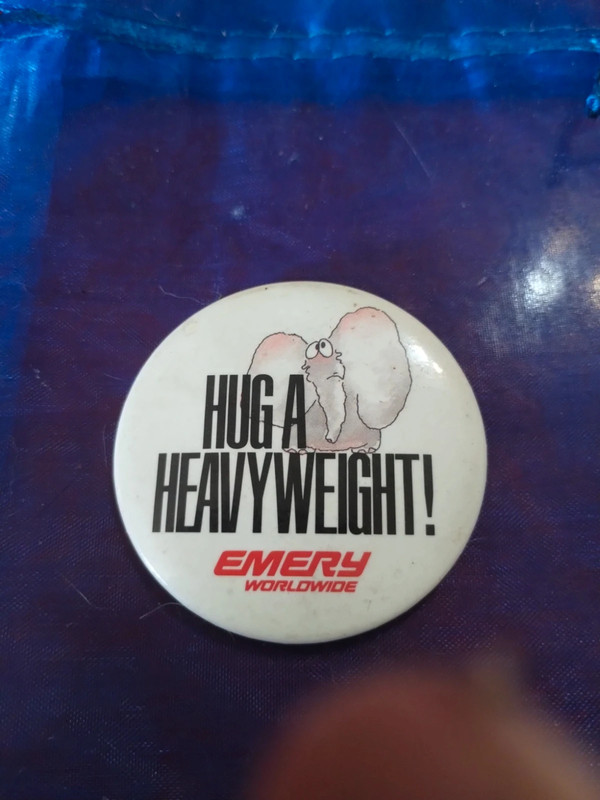 Really cute hug a heavyweight pin back button