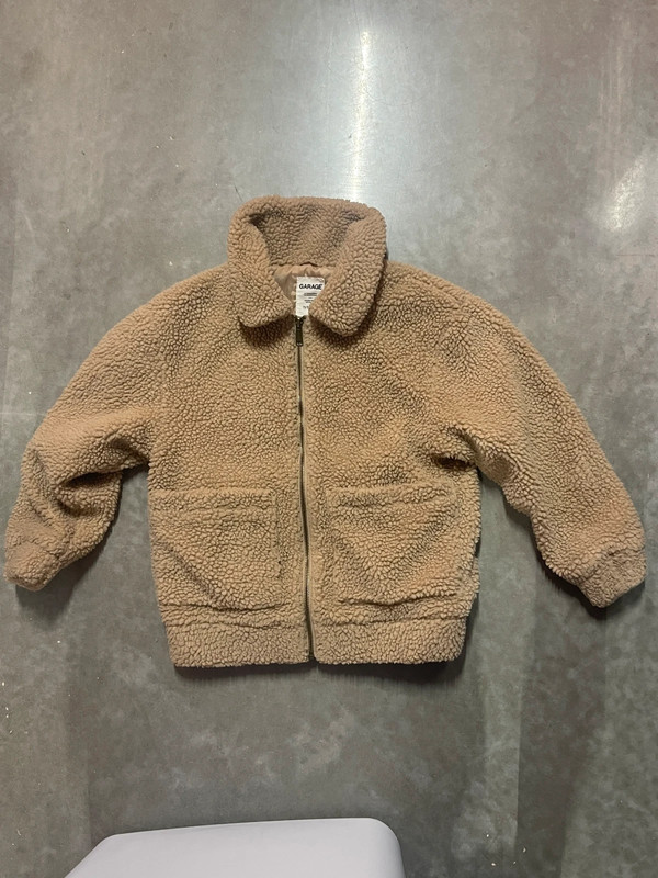 Teddy bear jacket’s brand is garage. 3