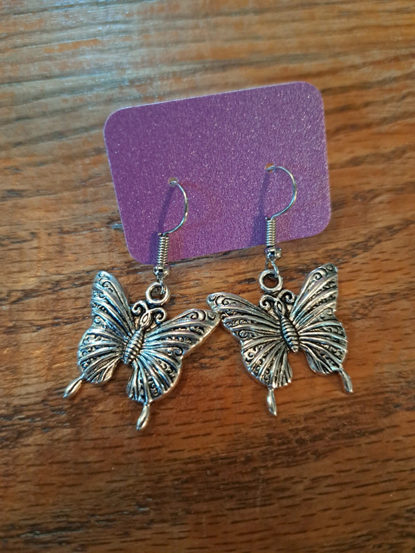 Butterfly charm earrings in silver 1