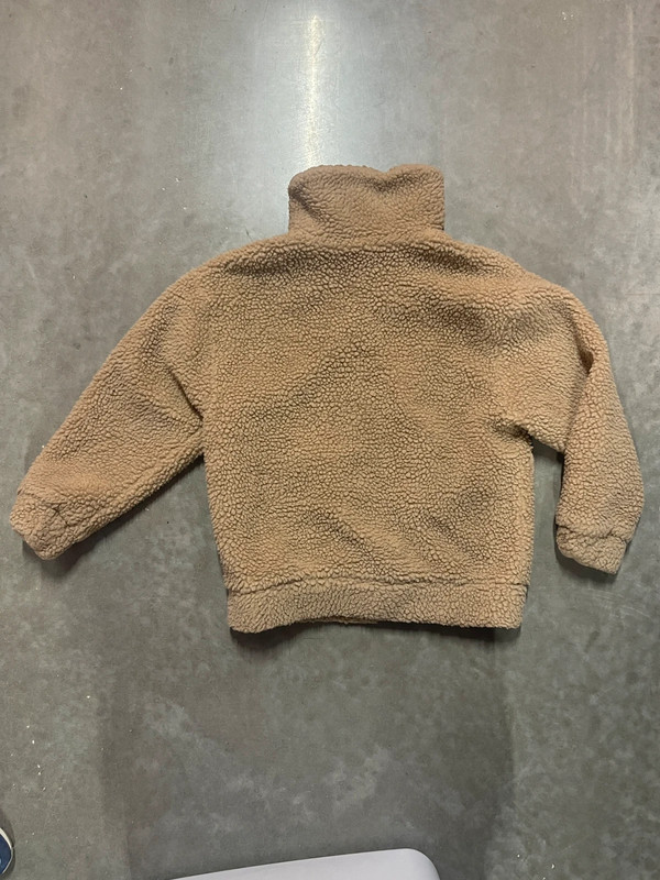 Teddy bear jacket’s brand is garage. 5