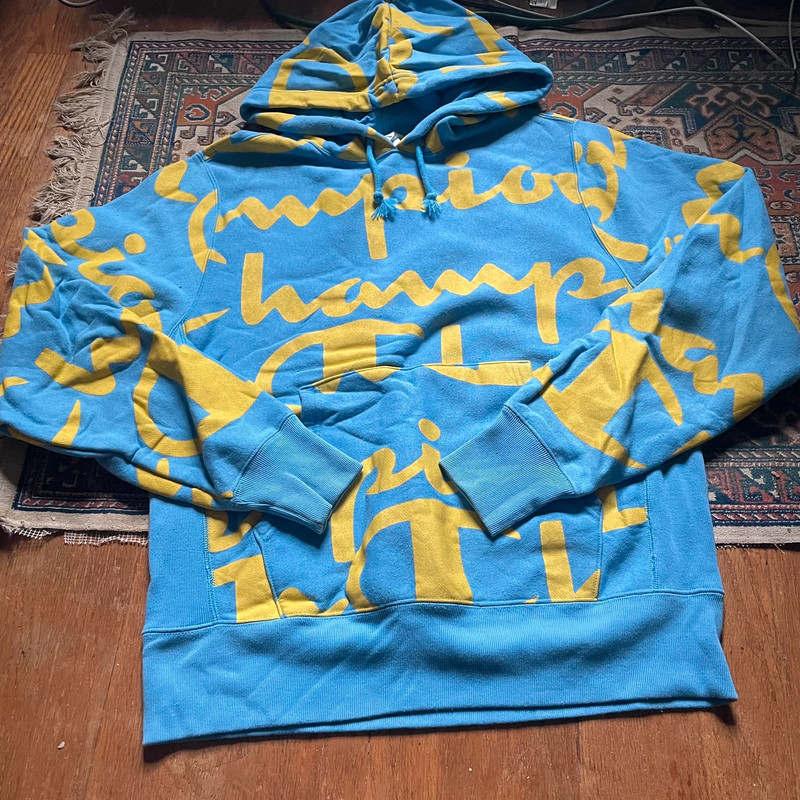 Champion Reverse Weave Hoodie in Blue/Yellow All Over Logo Print 1