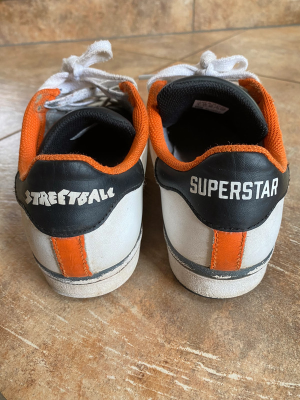 Adidas superstar black orange sales