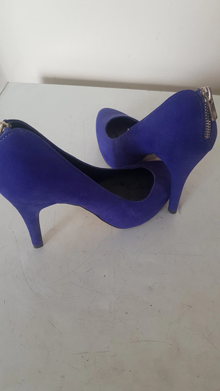 Stunning blue high heels with gold zip detail on back