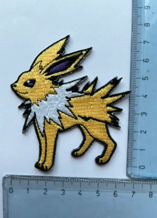 Patch Jolteon Pokémon toppa termoadesiva, marke: Pokémon, zustand: Sehr gut, größe: Einheitsgröße, 5,50 €, 6,48 € beinhaltet Vinted-Käuferschutz Pro