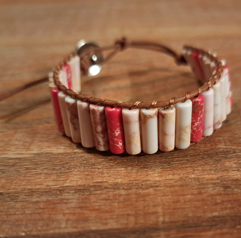 Pink stone bracelet with brown cord 1