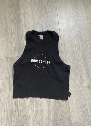 Top Reebok Les mills noir- taille XS, marque: Les Mills, état: Très bon état, taille: XS / 34 / 6, 10,00 €, 11,20 € Protection acheteurs incluse