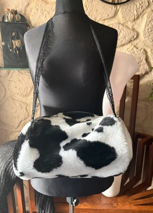 Zwart/ witte mof met opberg zakje, merk: laughing vampire, staat: Nieuw zonder prijskaartje, maat: Universele maat, € 10,00, € 11,20 inclusief Kopersbescherming Pro