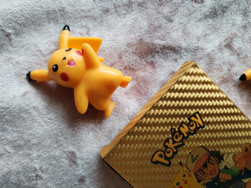 Gold pokemon card box and figures 5
