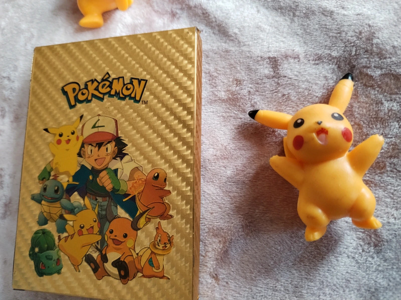 Gold pokemon card box and figures 4