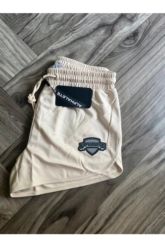 NEW Alphalete Woman’s Varsity Short - Tan ,size XS 3