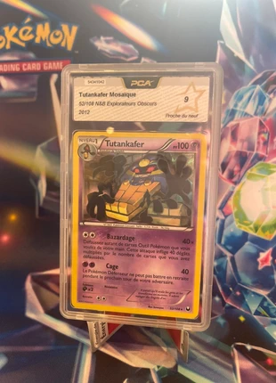 Tutankafer Mosaïque 52/108 N&B 2012, marke: Pokémon, zustand: Neu, 25,00 €, 26,95 € inklusive Vinted-Käuferschutz