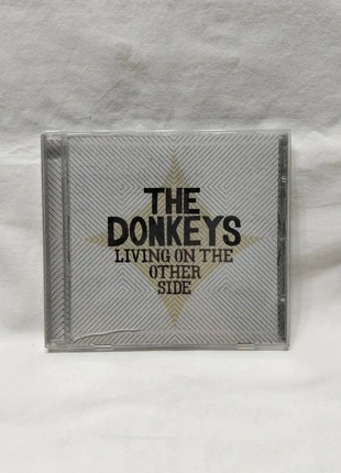 The Donkeys  Living on the Other Side CD nuevo precintado, condizioni: Nuovo con cartellino, €3.00, €3.85 include la Protezione acquisti