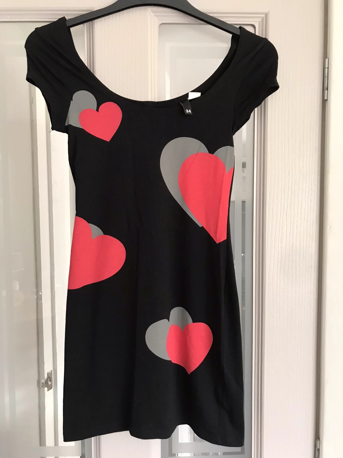 Black dress with red hearts sales