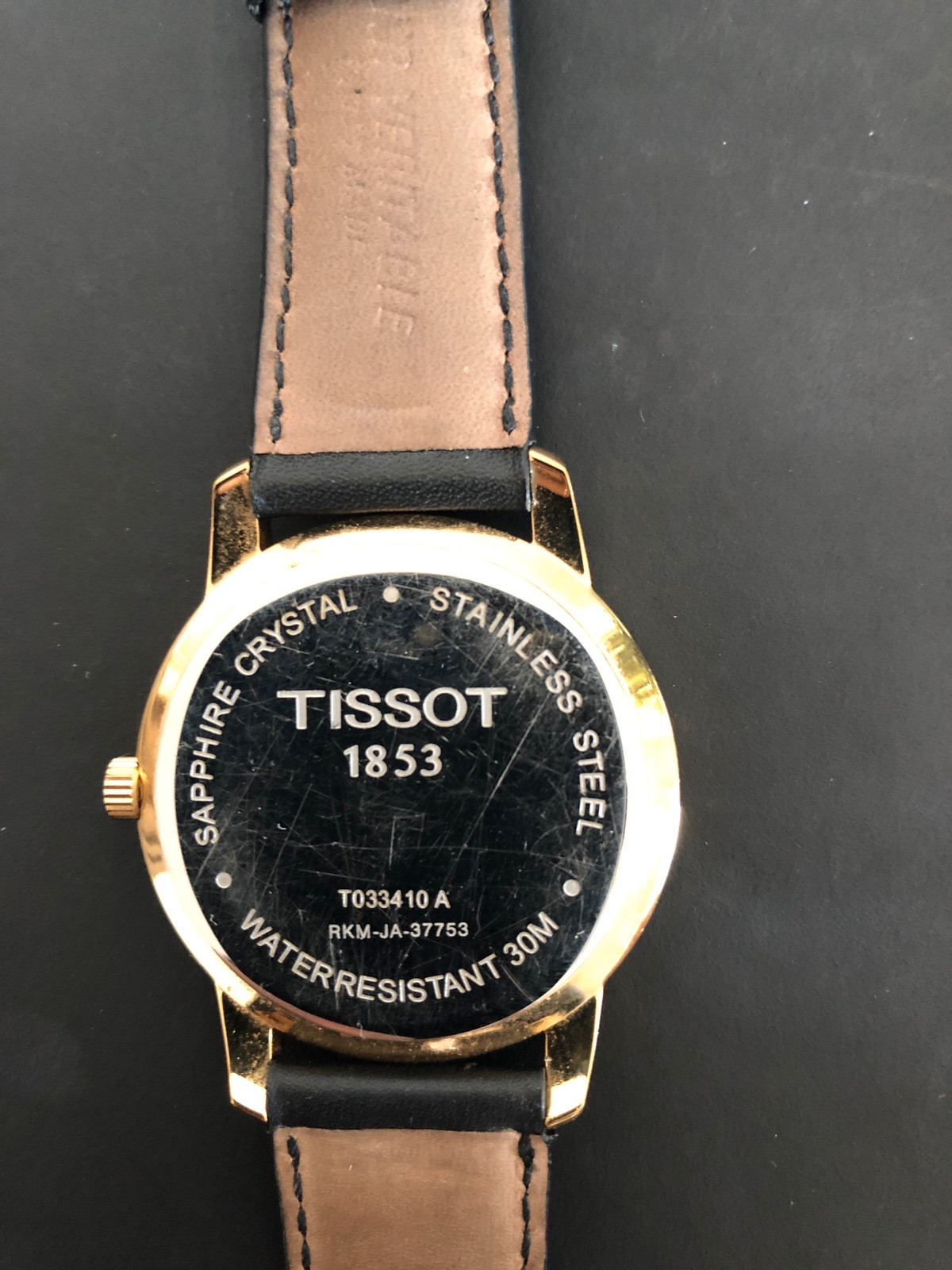 Montre Tissot T033410A plaqu or cristal saphir 30 m en cuir Date