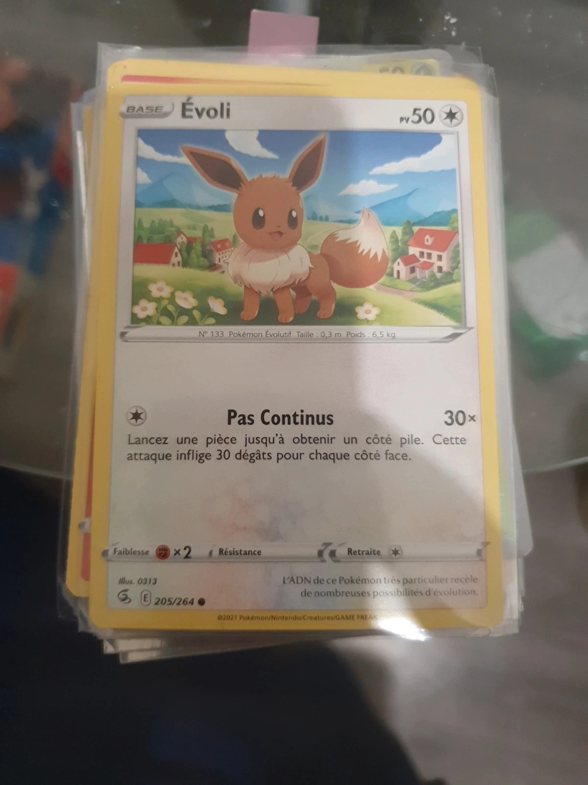 Evoli - carte Pokémon 205/264 Poing de Fusion
