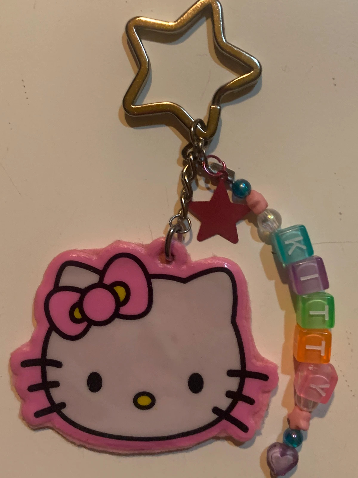 Portachiavi hello kitty rosa con scritta e stellina